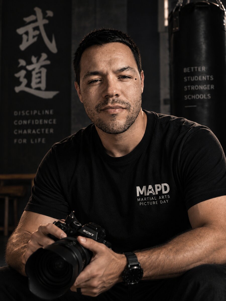 Johny, founder of Martial Arts Picture Day, holding a camera